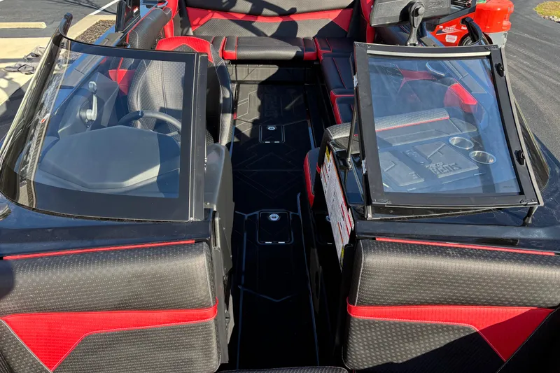 Slide: The Image of 2026 Supreme S240 boat interior with red and black seating, dual windshields, and modern dashboard. - 8
