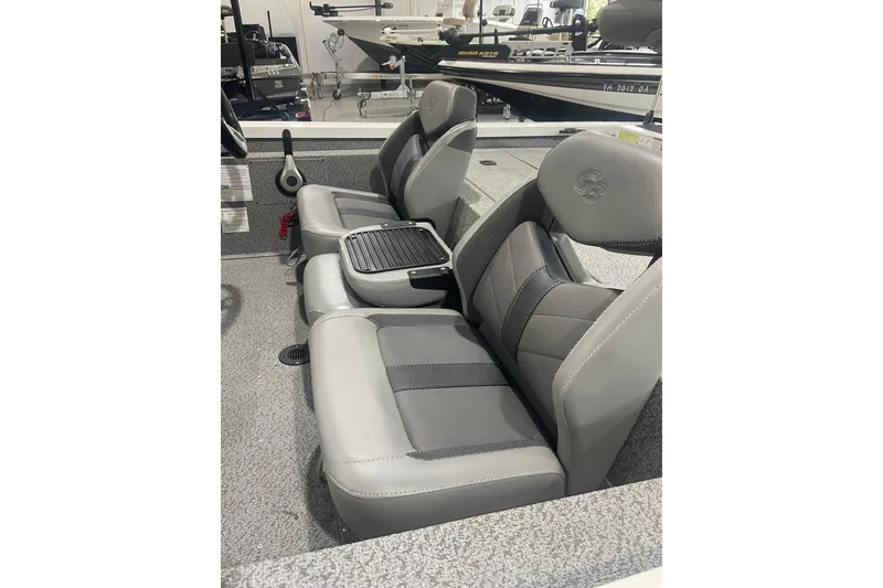 Slide: The Image of 2022 G3 Sportsman 1710 Vinyl boat interior with gray seating and steering console. - 4