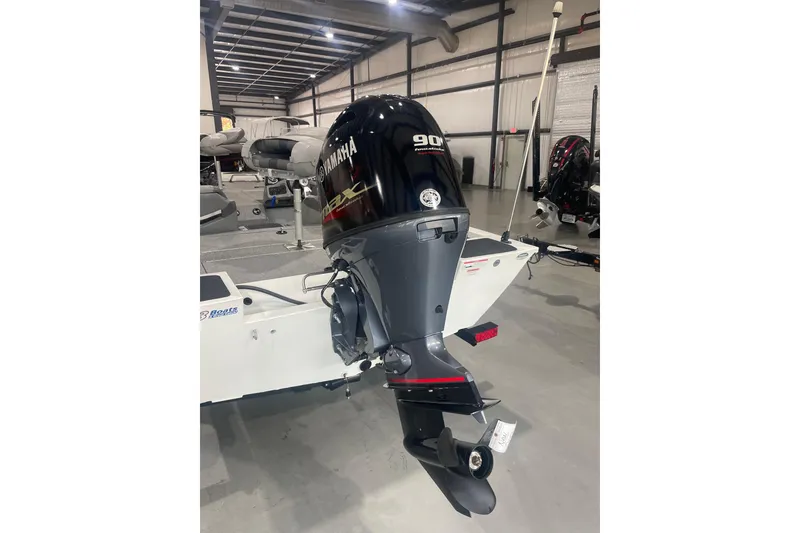 Slide: The Image of 2022 G3 Sportsman 1710 Vinyl boat with Yamaha 90 horsepower outboard motor in showroom. - 8