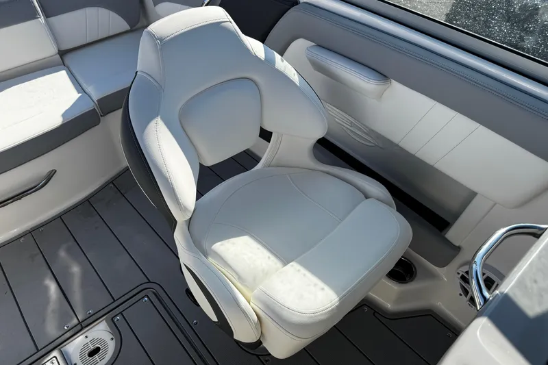 Slide: The Image of 2024 Chaparral 21 SSi OB boat interior with sleek seating and modern design. - 17