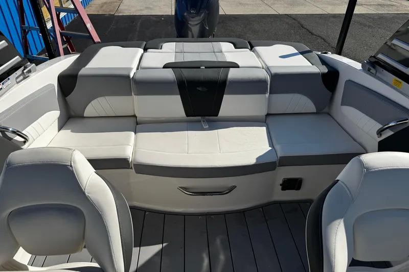 Slide: The Image of 2024 Chaparral 21 SSi OB boat interior with white and gray seating arrangement. - 18