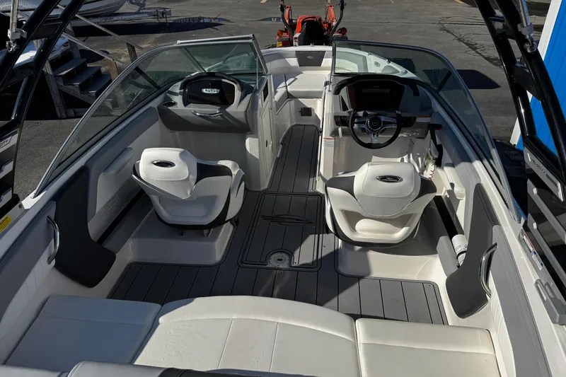 Slide: The Image of 2024 Chaparral 21 SSi OB boat interior with modern seating and steering console. - 20