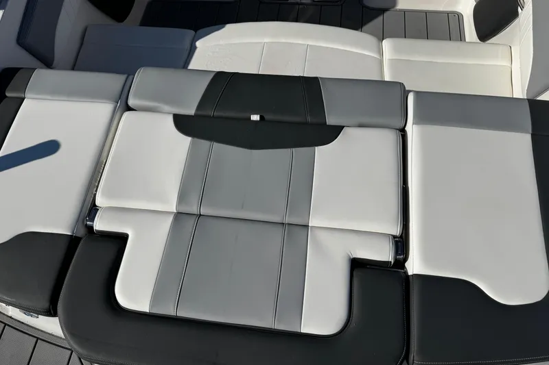 Slide: The Image of 2024 Chaparral 21 SSi OB boat interior with sleek, modern seating design. - 21