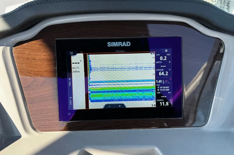 Slide: The Image of Simrad display on 2024 Chaparral 21 SSi OB showing navigation and depth data. - 28