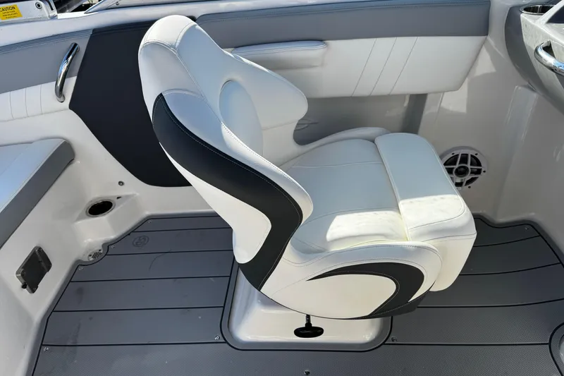 Slide: The Image of 2024 Chaparral 21 SSi OB boat interior with white and black seating. - 34