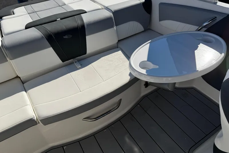 Slide: The Image of 2024 Chaparral 21 SSi OB boat interior with seating and round table. - 35