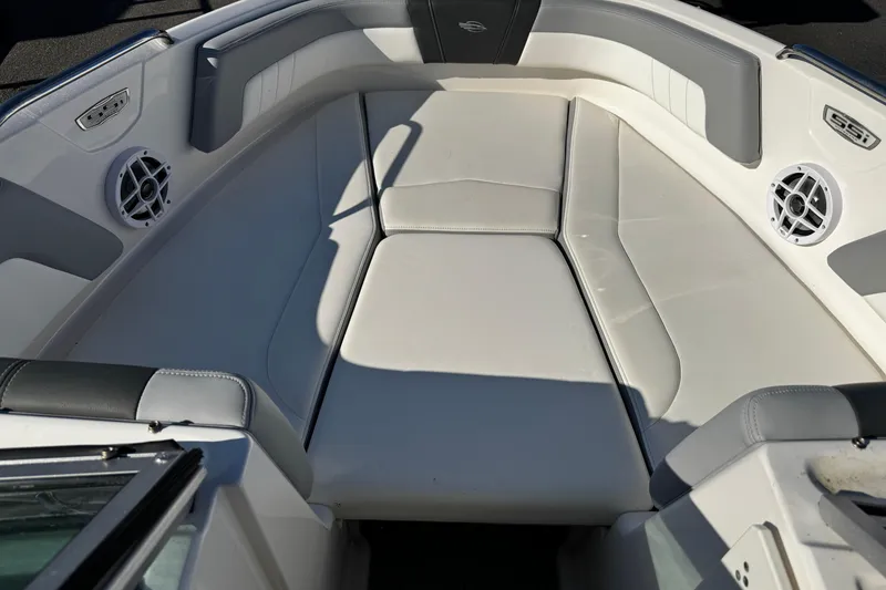Slide: The Image of 2024 Chaparral 21 SSi OB boat interior with cushioned seating and built-in speakers. - 36