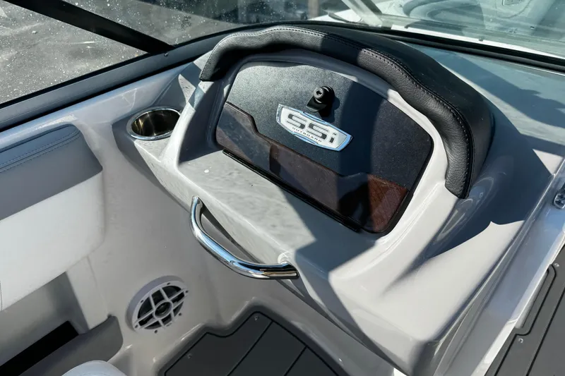Slide: The Image of 2024 Chaparral 21 SSi OB boat dashboard with cup holder and speaker. - 38