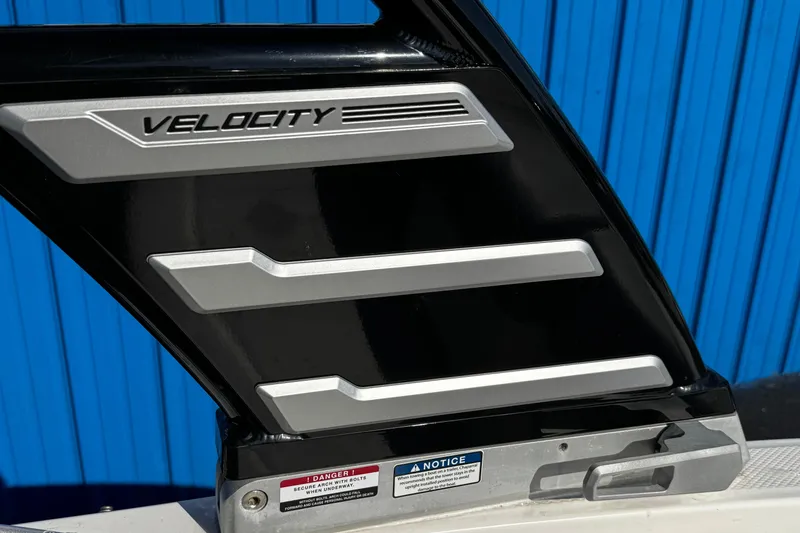 Slide: The Image of 2024 Chaparral 21 SSi OB boat detail with "Velocity" branding on black structure. - 43