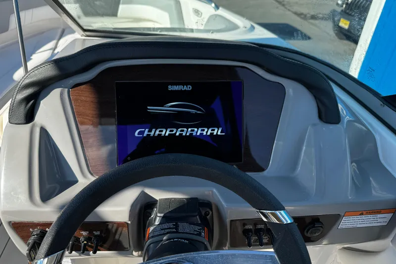 Slide: The Image of Dashboard of 2024 Chaparral 21 SSi OB boat with Simrad display. - 7
