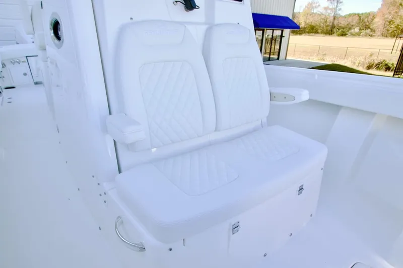 Slide: The Image of Luxurious white seating on 2026 Regulator 31 boat, featuring diamond-stitched upholstery. - 12