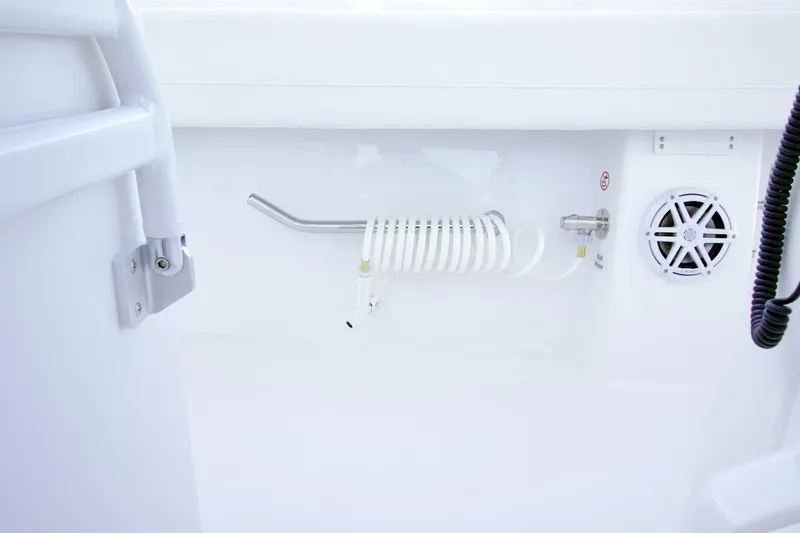 Slide: The Image of 2026 Regulator 31 boat interior with coiled hose and speaker detail. - 19