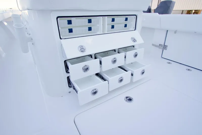 Slide: The Image of Storage drawers on a 2026 Regulator 31 boat, featuring sleek white design. - 20