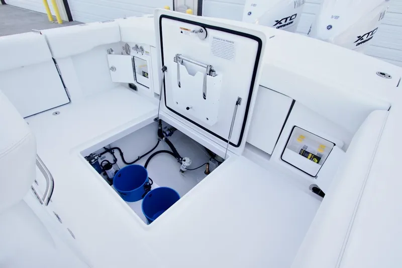 Slide: The Image of 2026 Regulator 31 boat interior with open storage compartments and visible wiring. - 23