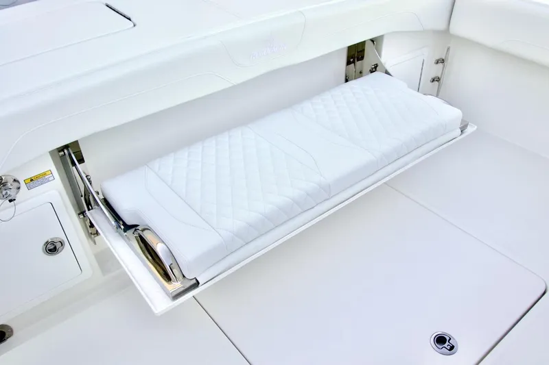 Slide: The Image of 2026 Regulator 31 boat with a foldable white cushioned seat. - 26