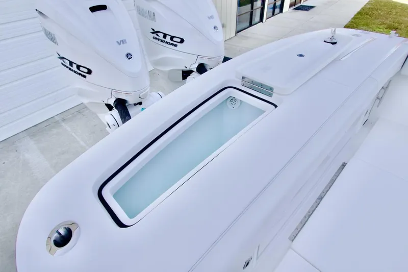 Slide: The Image of 2026 Regulator 31 boat with Yamaha XTO Offshore engines, featuring sleek design and modern amenities. - 27