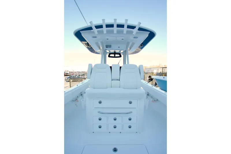Slide: The Image of 2026 Regulator 31 boat interior with white seating and storage drawers. - 29