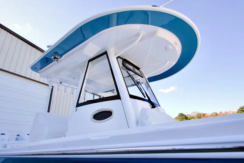 Slide: The Image of 2026 Regulator 31 boat with sleek design and modern features, docked outdoors. - 3