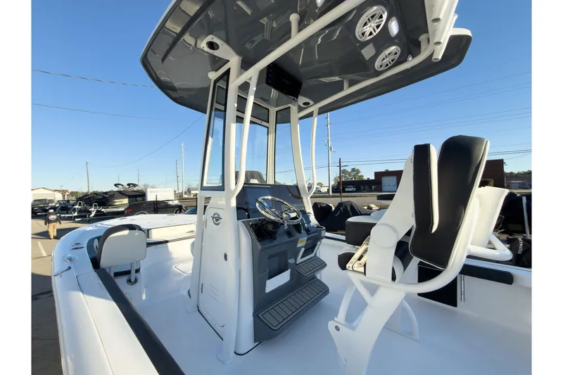 Slide: The Image of 2026 Tidewater 2300 Carolina Bay boat interior with helm and seating. - 10