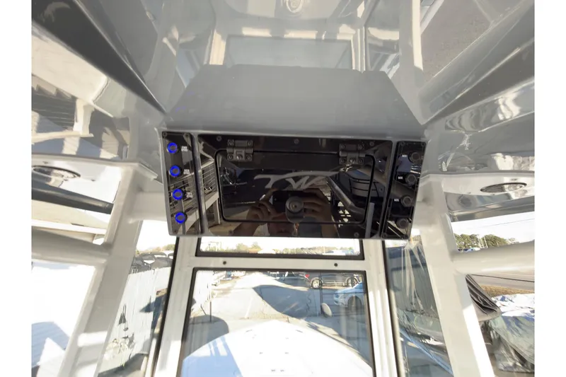 Slide: The Image of 2026 Tidewater 2300 Carolina Bay boat console with electronic controls and navigation system. - 15