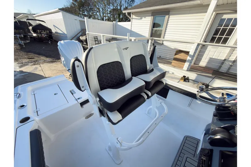 Slide: The Image of 2026 Tidewater 2300 Carolina Bay boat interior with dual seats and steering wheel. - 18
