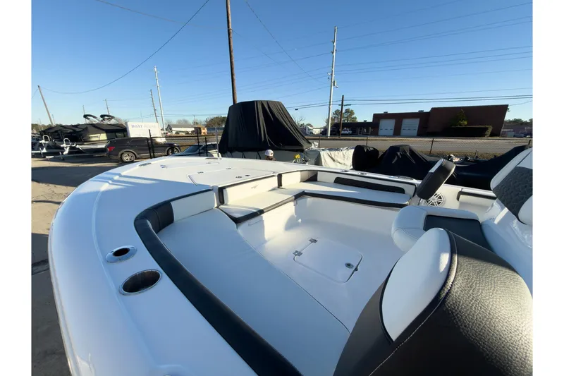 Slide: The Image of 2026 Tidewater 2300 Carolina Bay boat interior with seating and storage compartments. - 31