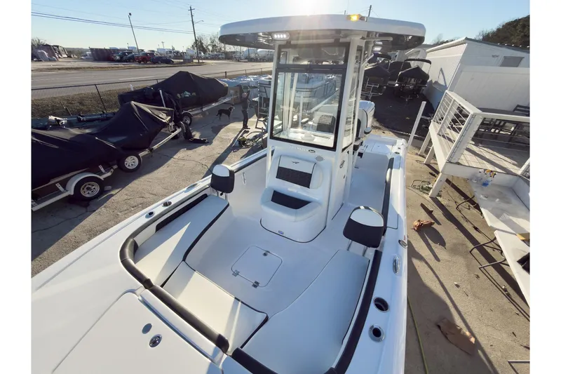 Slide: The Image of 2026 Tidewater 2300 Carolina Bay boat, sleek design, spacious deck, modern features, outdoor setting. - 34