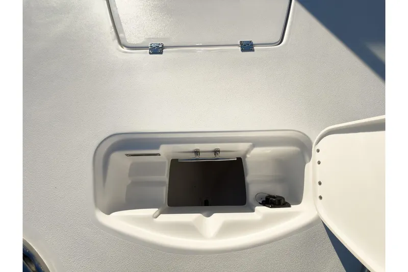Slide: The Image of 2026 Tidewater 2300 Carolina Bay boat storage compartment with open hatch. - 36