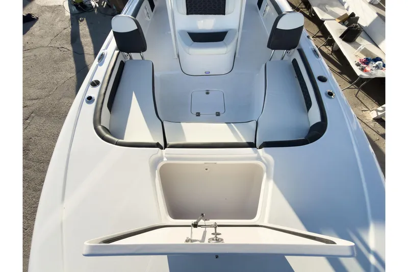 Slide: The Image of 2026 Tidewater 2300 Carolina Bay boat interior with seating and storage compartments. - 37