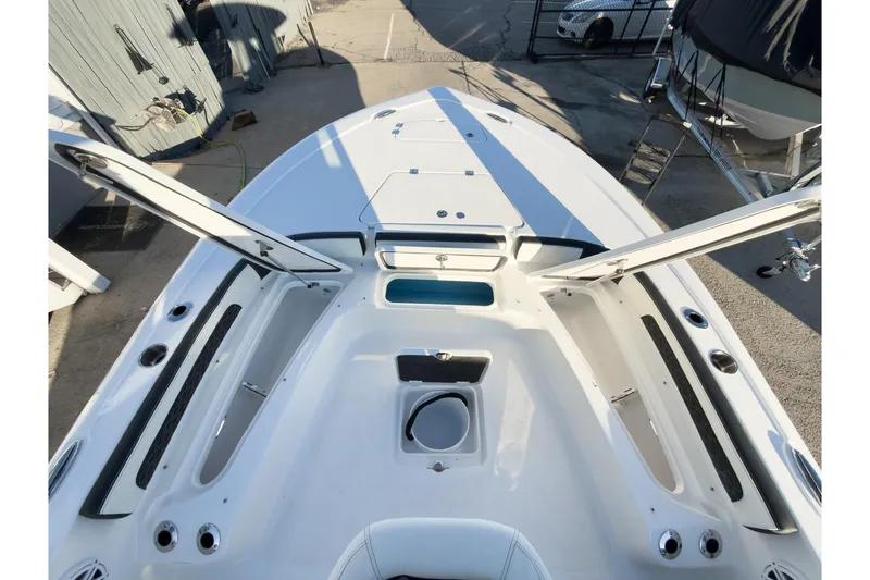 Slide: The Image of 2026 Tidewater 2300 Carolina Bay boat deck with open storage compartments. - 38