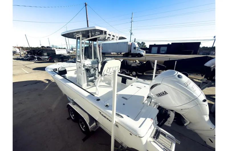 Slide: The Image of 2026 Tidewater 2300 Carolina Bay boat with Yamaha engine, parked on a trailer. - 4