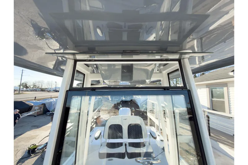 Slide: The Image of 2026 Tidewater 2300 Carolina Bay boat interior with modern design and seating. - 42