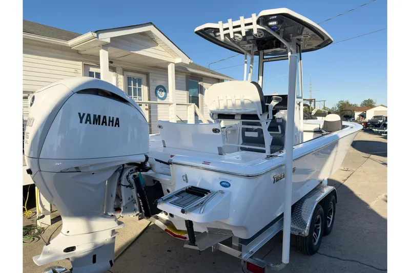 Slide: The Image of 2026 Tidewater 2300 Carolina Bay boat with Yamaha engine, parked on a trailer. - 6
