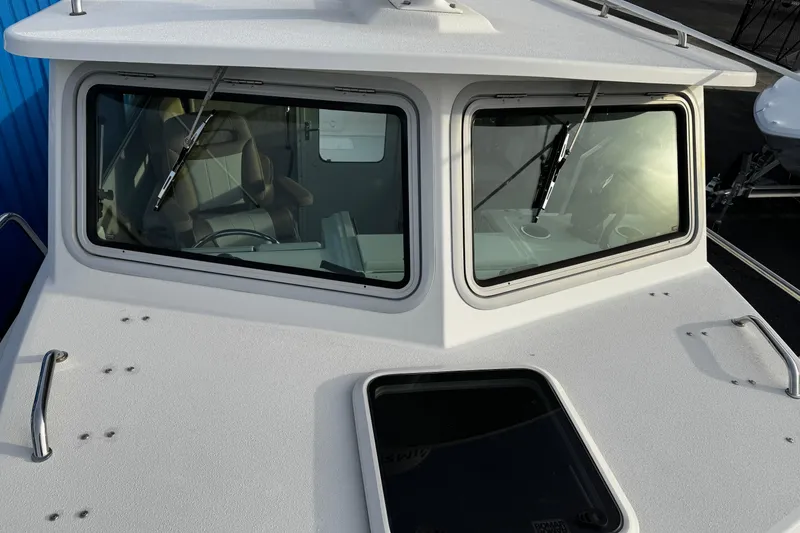 Slide: The Image of 2018 Parker 2520 XLD Sport Cabin boat with windshield and wipers. - 12