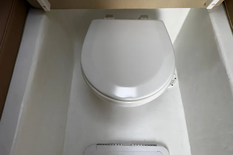 Slide: The Image of 2018 Parker 2520 XLD Sport Cabin boat toilet interior view. - 22