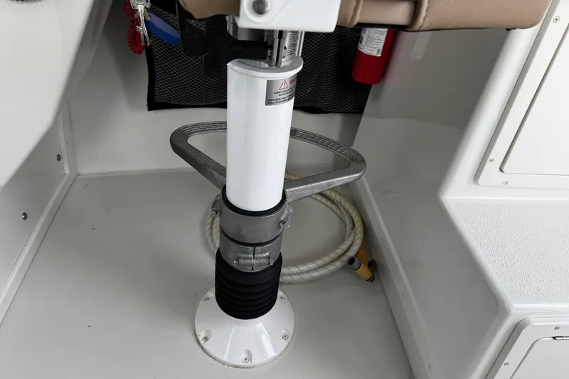 Slide: The Image of 2018 Parker 2520 XLD Sport Cabin interior, featuring a seat pedestal and safety equipment. - 23