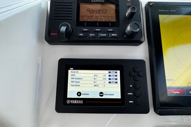 Slide: The Image of Control panel of a 2018 Parker 2520 XLD Sport Cabin with Yamaha and Garmin displays. - 25
