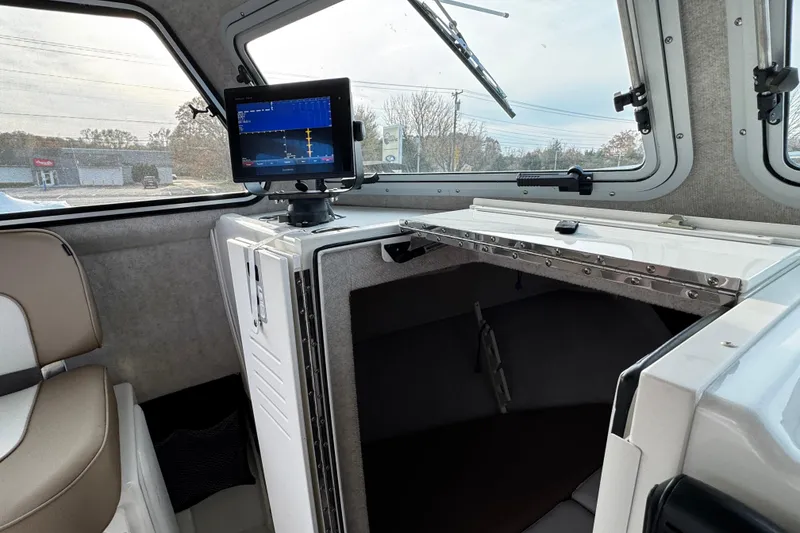Slide: The Image of 2018 Parker 2520 XLD Sport Cabin interior with navigation display and seating. - 26