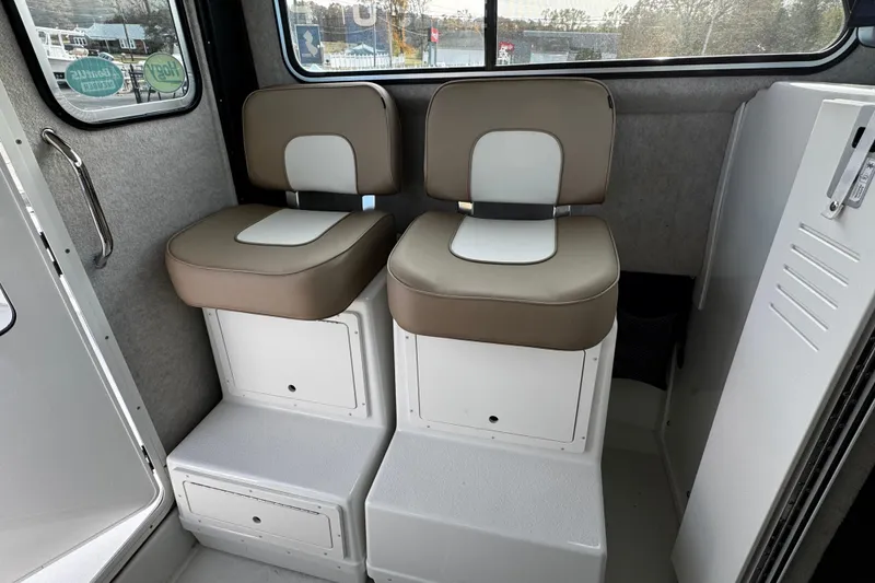 Slide: The Image of 2018 Parker 2520 XLD Sport Cabin interior with two cushioned seats. - 27