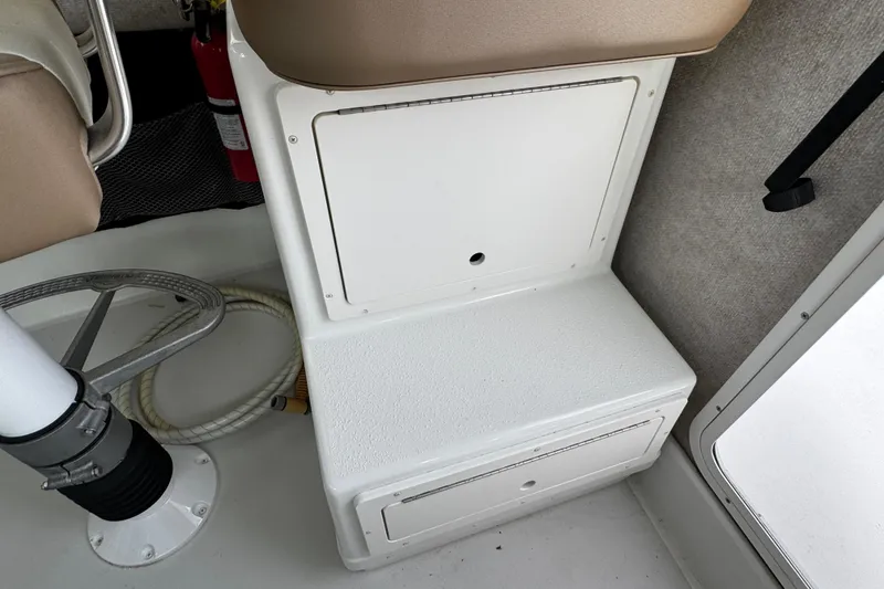 Slide: The Image of Interior of 2018 Parker 2520 XLD Sport Cabin with storage compartments and seating. - 29