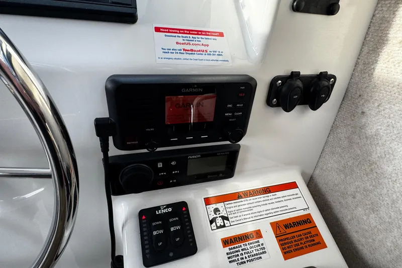 Slide: The Image of Control panel of a 2018 Parker 2520 XLD Sport Cabin boat with Garmin and Fusion systems. - 32