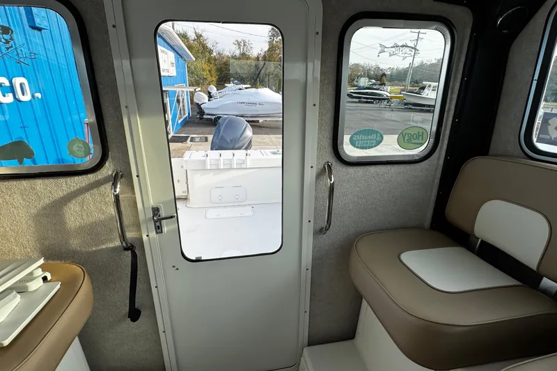 Slide: The Image of Interior view of 2018 Parker 2520 XLD Sport Cabin with seating and door. - 38
