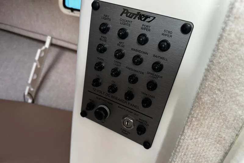 Slide: The Image of Control panel of 2018 Parker 2520 XLD Sport Cabin boat with various switches. - 41