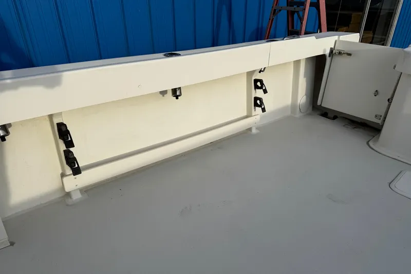 Slide: The Image of 2018 Parker 2520 XLD Sport Cabin boat interior with storage compartments. - 44