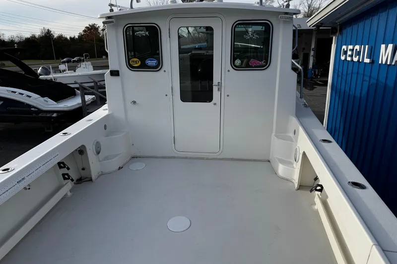 Slide: The Image of 2018 Parker 2520 XLD Sport Cabin boat deck, spacious and well-maintained, at Cecil Marine. - 5