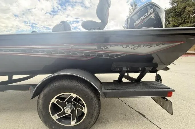 Slide: The Image of 2021 Ranger RT178 boat with Mercury engine on trailer, parked outdoors. - 10
