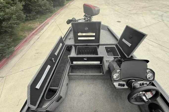 Slide: The Image of 2021 Ranger RT178 boat interior with open storage compartments and steering console. - 13
