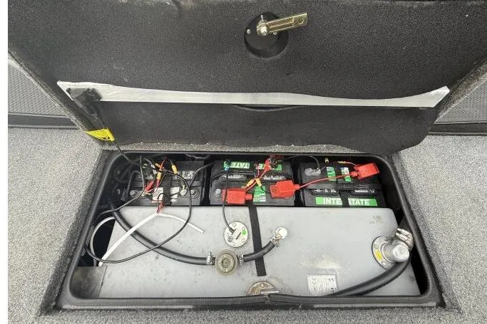 Slide: The Image of 2021 Ranger RT178 boat battery compartment with wiring and components visible. - 21