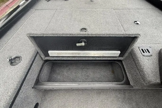 Slide: The Image of 2021 Ranger RT178 boat storage compartment with open lid, showcasing spacious interior. - 23