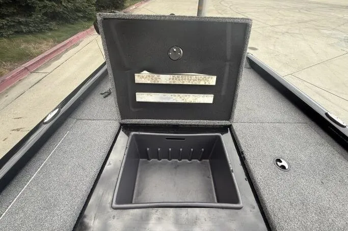 Slide: The Image of 2021 Ranger RT178 boat storage compartment open, showing interior details. - 24